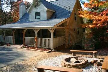 The family will surely enjoy gathering around the cabin rental's fire pit .